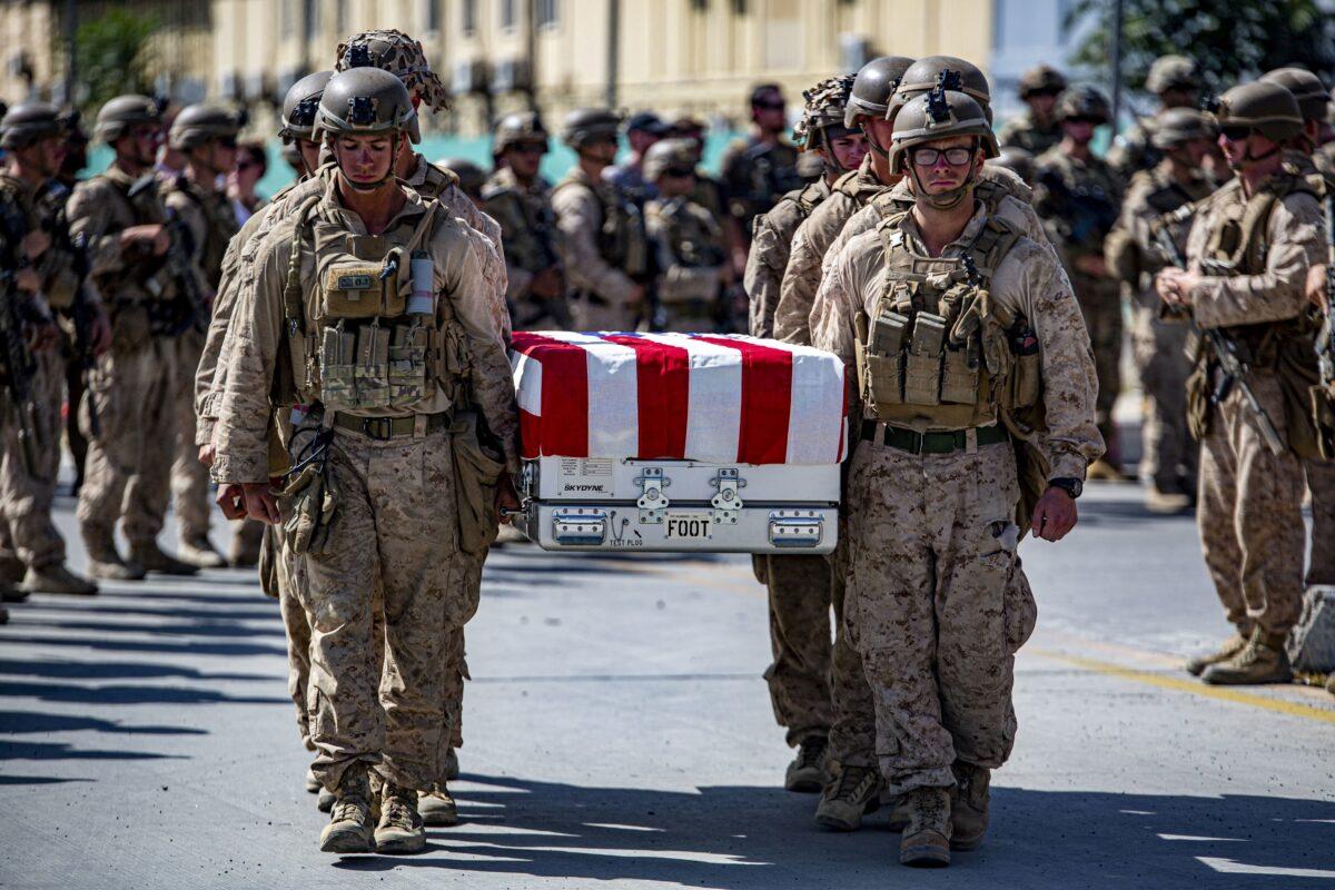 U.S. service members act as pallbearers for the service members killed in action during operations at Hamid Karzai International Airport in Kabul, Afghanistan on Aug. 27, 2021. (U.S. Marine Corps/1st Lt. Mark Andries via Reuters)