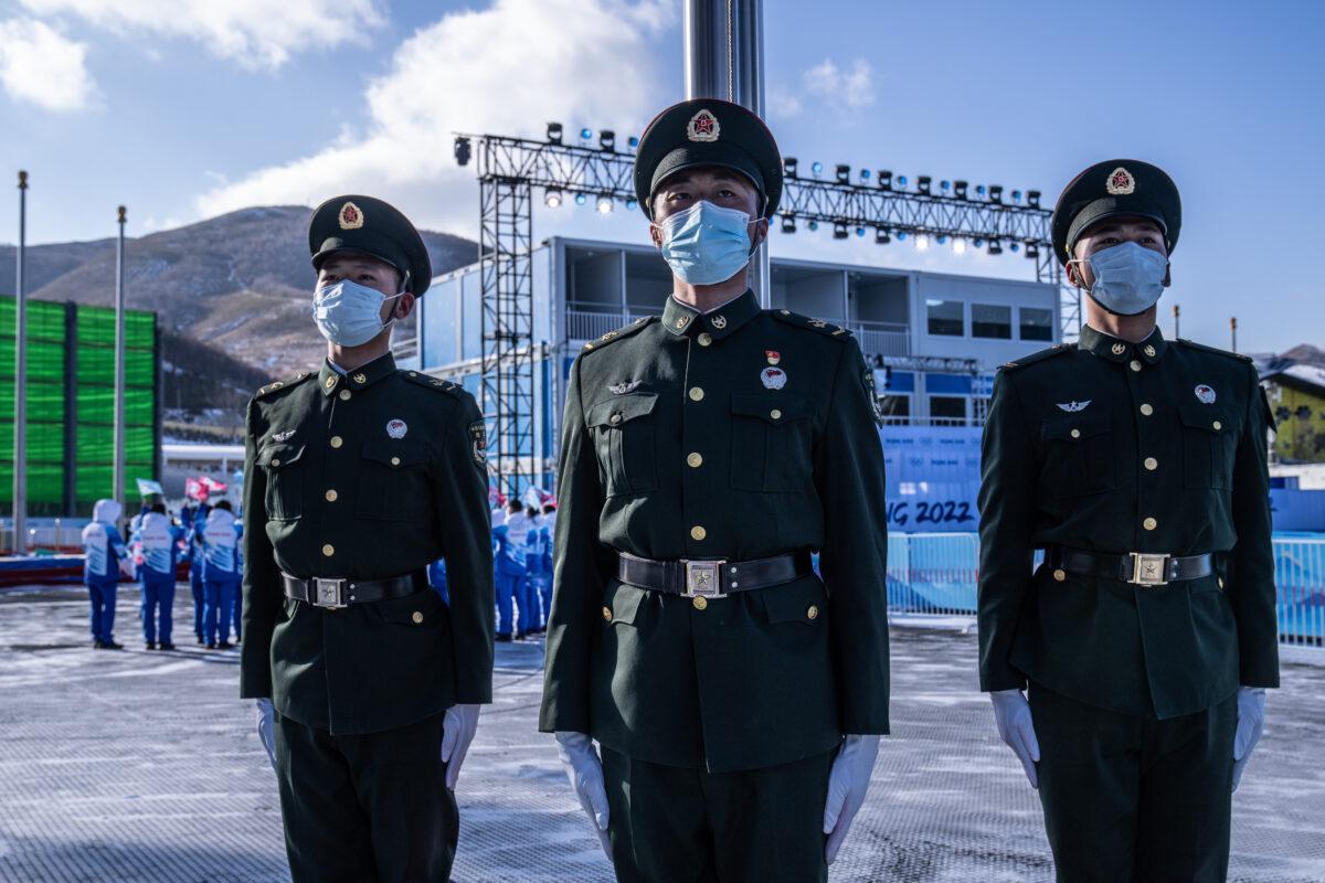 Peoples Liberation Army soldiers rehearse a flag-raising drill at the medal plaza in Zhangjiakou Olympic village in Zhangjiakou, China, on Jan. 25, 2022. (Carl Court/Getty Images)