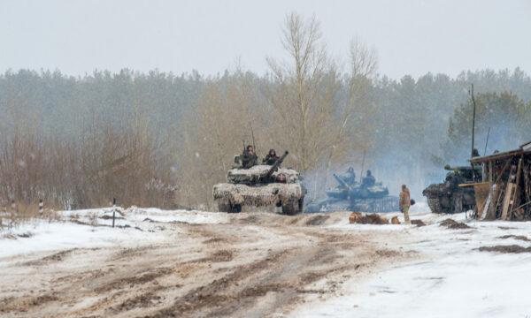 Ukrainian Military Forces servicemen of the 92nd mechanized brigade use tanks, self-propelled guns and other armored vehicles to conduct live-fire exercises near the town of Chuguev, in the Kharkiv region, on Feb. 10, 2022. (Sergey Bobok/AFP via Getty Images)