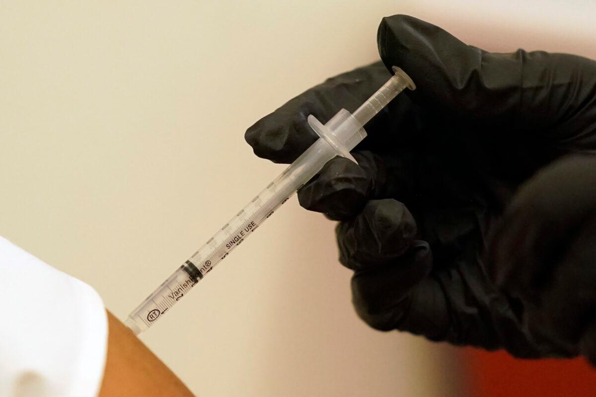 A person is injected with Pfizer's COVID-19 vaccine in Dallas, in a file image. (LM Otero/AP Photo)