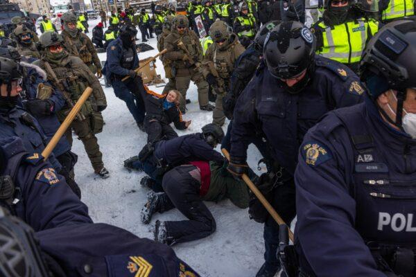 Police face off with demonstrators in Ottawa on Feb. 19, 2022. (Alex Kent/Getty Images)
