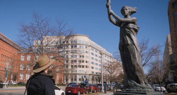 James H. White in front of the Victims of Communism Memorial in Washington, D.C., in “Canaries in a Cold War.” (Magnason Films)