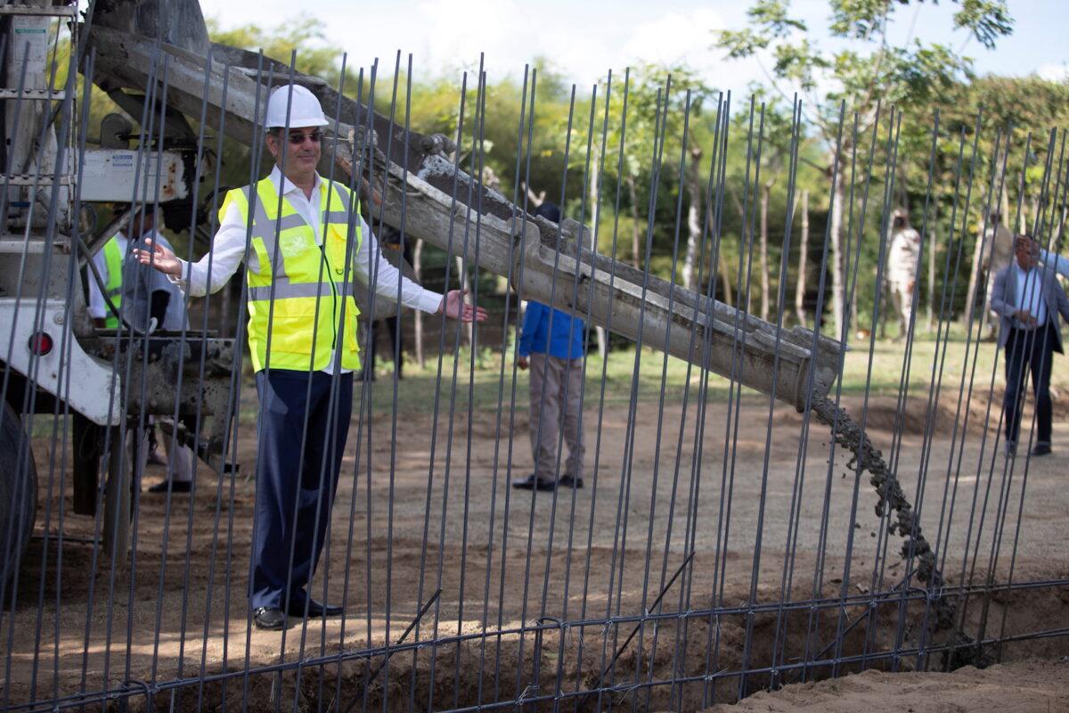 Dominican President Luis Abinader gestures near the construction of a border wall that will cover almost half of the border with Haiti to stop illegal immigration and criminal activities in Abanico, in Dajabon Province, Dominican Republic, on Feb. 20, 2022. (Fran Afonso/Reuters)
