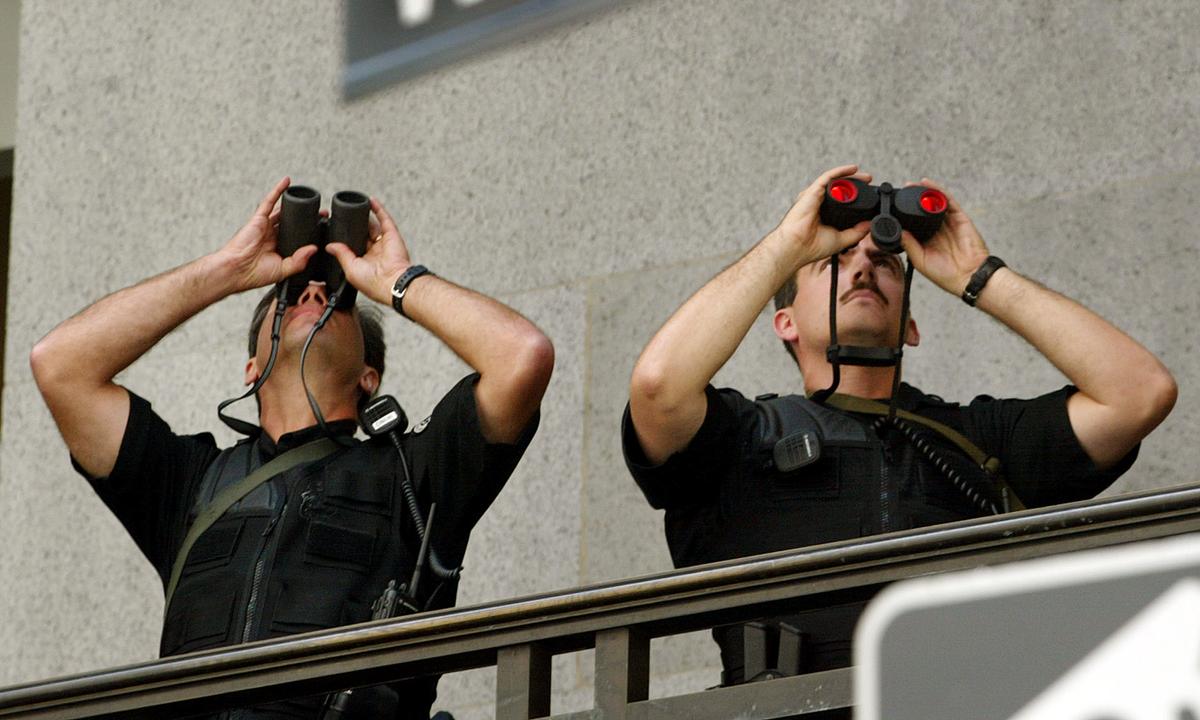Members of the Secret Service keep an eye on Wall Street in New York on Sept. 6, 2002. (Mario Tama/Getty Images)