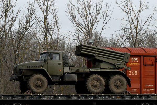 Russian military vehicles are seen loaded on train platforms some 30 miles off the border with the self-proclaimed Donetsk People's Republic in Russia's southern Rostov region on Feb. 23, 2022. (Stringer/AFP via Getty Images)