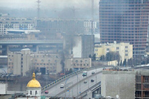 Smoke and flame rise near a military building after an apparent Russian strike in Kyiv, Ukraine, on Feb. 24, 2022. (Efrem Lukatsky/AP Photo)