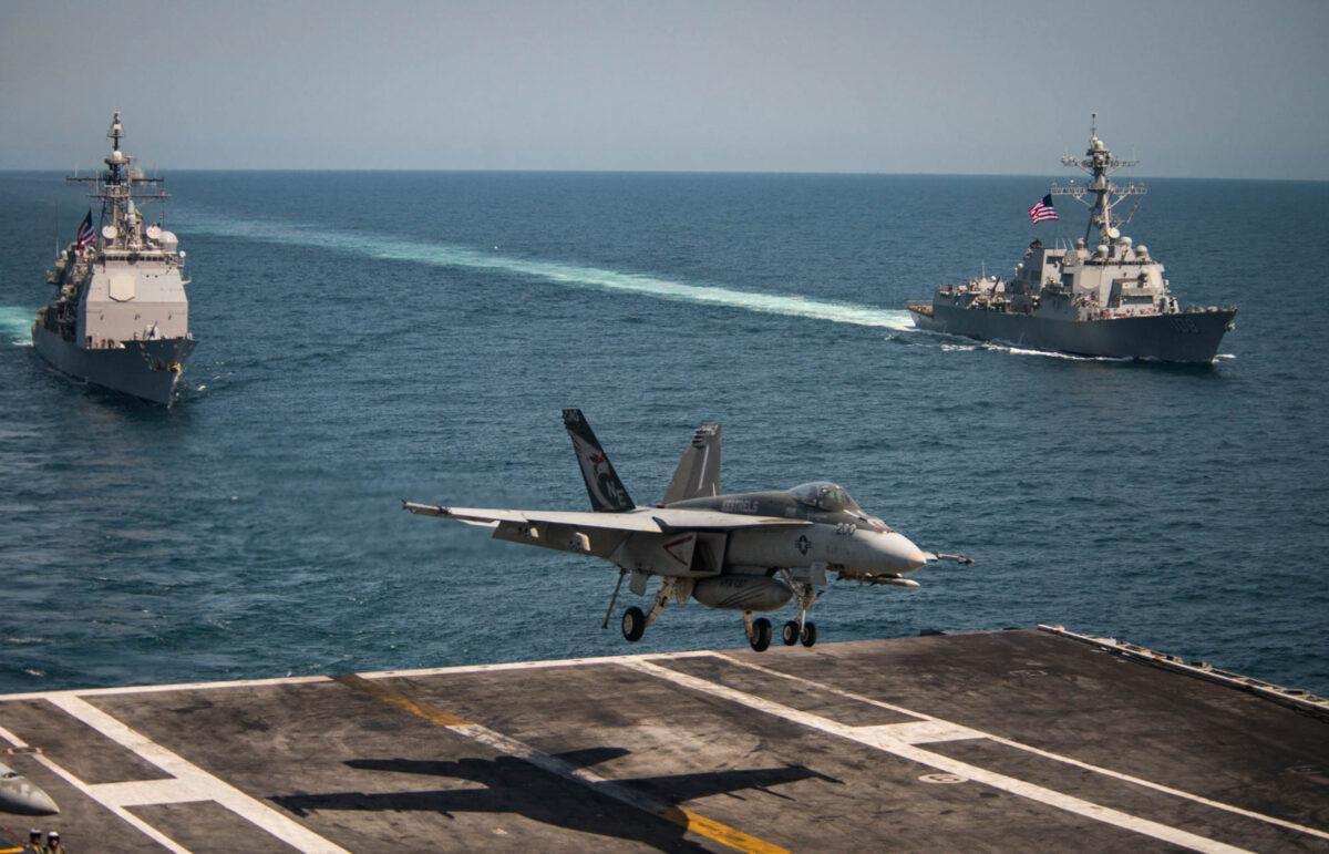 From the U.S. Navy, a F/A-18E Super Hornet from the Kestrels of Strike Fighter Squadron 137 (VFA-137) lands on the flight deck of the Nimitz-class aircraft carrier USS Carl Vinson (CVN 70) in the western Pacific Ocean on May 3, 2017. (Sean M. Castellano/Getty Images)