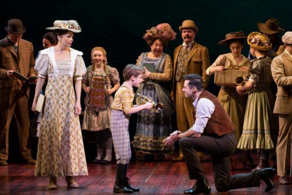 (L―R foreground) Sutton Foster, Benjamin Pajak, and Hugh Jackson in a scene in "The Music Man," now playing on Broadway. (Joan Marcus)