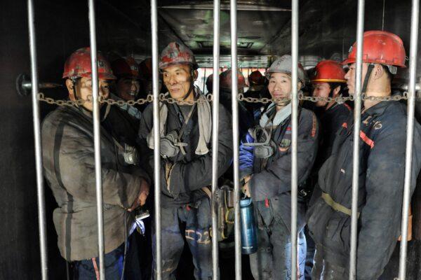Miners prepare to go into an underground coal mine in Huaibei in Eastern China's Anhui Province on Feb. 16, 2022. (STR/AFP via Getty Images)