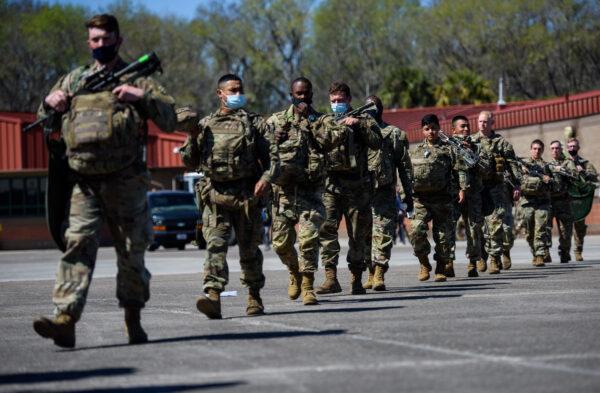 Members of the 1st Armored Brigade Combat Team, 3rd Battalion, 69th Armored Regiment deploy to Germany in Savannah, Ga., on March 2, 2022. (Melissa Sue Gerrits/Getty Images)