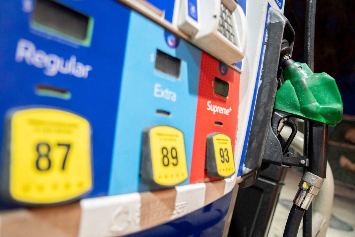 A gasoline pump sits in a holder at an Exxon gas station in Washington, D.C., on March 13, 2022. (Stefani Reynolds/AFP via Getty Images)