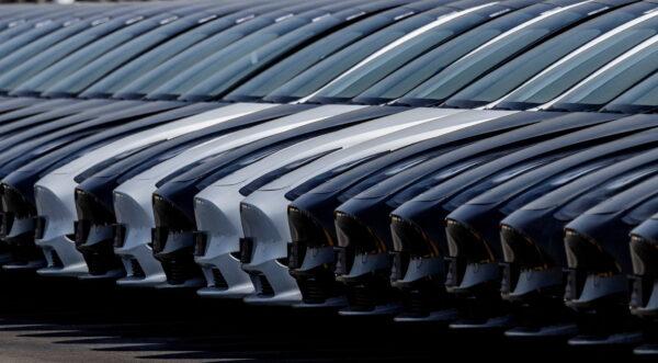 Tesla cars are seen parked at the construction site of the new Tesla Gigafactory for electric cars in Gruenheide, Germany, on March 20, 2022. (REUTERS/Hannibal Hanschke)