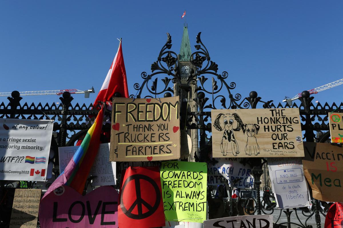The front gate of Parliament of Canada is covered with banners, as demonstrators continue to protest the vaccine mandates implemented by Prime Minister Justin Trudeau, on Feb. 7, 2022, in Ottawa, Canada. (Dave Chan/AFP via Getty Images)
