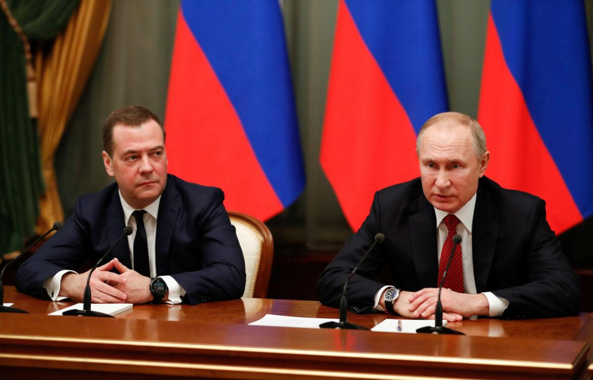 Russian President Vladimir Putin (R) and deputy security council chief Dmitry Medvedev attend a meeting with members of the government in Moscow on Jan. 15, 2020. (Sputnik/Dmitry Astakhov/Pool via Reuters/File Photo)