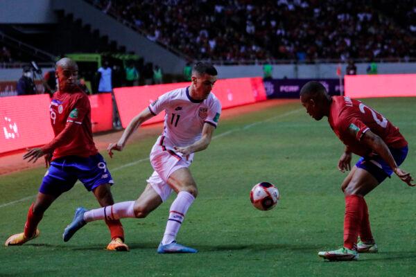 Giovanni Reyna of the United States fights for the ball with Carlos Mora and Ian Lawrance of Costa Rica during a match between Costa Rica and the United States as part of the Concacaf 2022 FIFA World Cup Qualifiers at Estadio Nacional, in San Jose, Costa Rica, on March 30, 2022. (Arnoldo Robert/Getty Images)