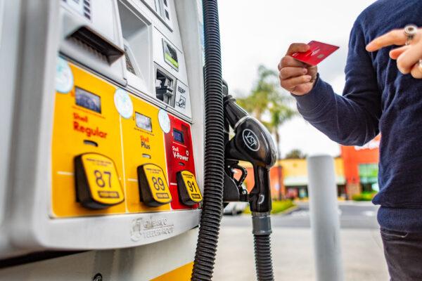 A man pumps gas in Irvine, Calif., on April 1, 2022. (John Fredricks/The Epoch Times)