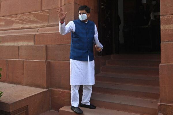 India's Minister of Textiles, Commerce and Industry Piyush Goyal waves to media as he arrives to attend the winter session of the parliament in New Delhi, India, on Nov. 29, 2021. (Money Sharma/AFP via Getty Images)