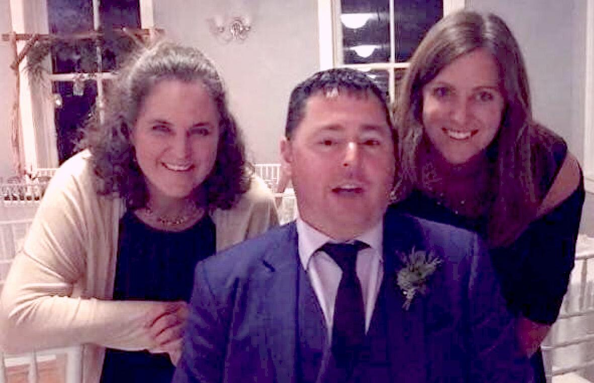 Steve with his half-sisters at his daughter's wedding. (Courtesy ofRebecca Crist)