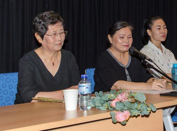 Tian Feng Ying (L) at a panel on forced labour in China following a screening of "Letter from Masanjia" in Perth, Australia, on Dec. 9, 2019. Tian is holding flower decorations similar to those she was forced to make while at the Shandong No. 1 Female Labor Camp between 2002 and 2005 in Jinan City, China. (The Epoch Times)