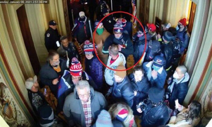 In an image from video, Dustin Thompson, circled, is spotted inside the U.S. Capitol on Jan. 6, 2021. Thompson was found guilty by a District of Columbia jury on four Jan. 6-related charges on April 14, 2022. (DOJ via The Epoch Times)
