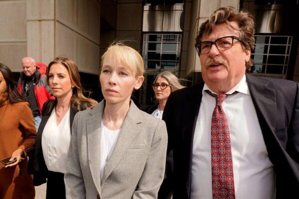 Sherri Papini of Redding leaves the federal courthouse accompanied by her attorney, William Portanova, right, in Sacramento, Calif. on April 13, 2022. (Rich Pedroncelli/AP Photo/File)