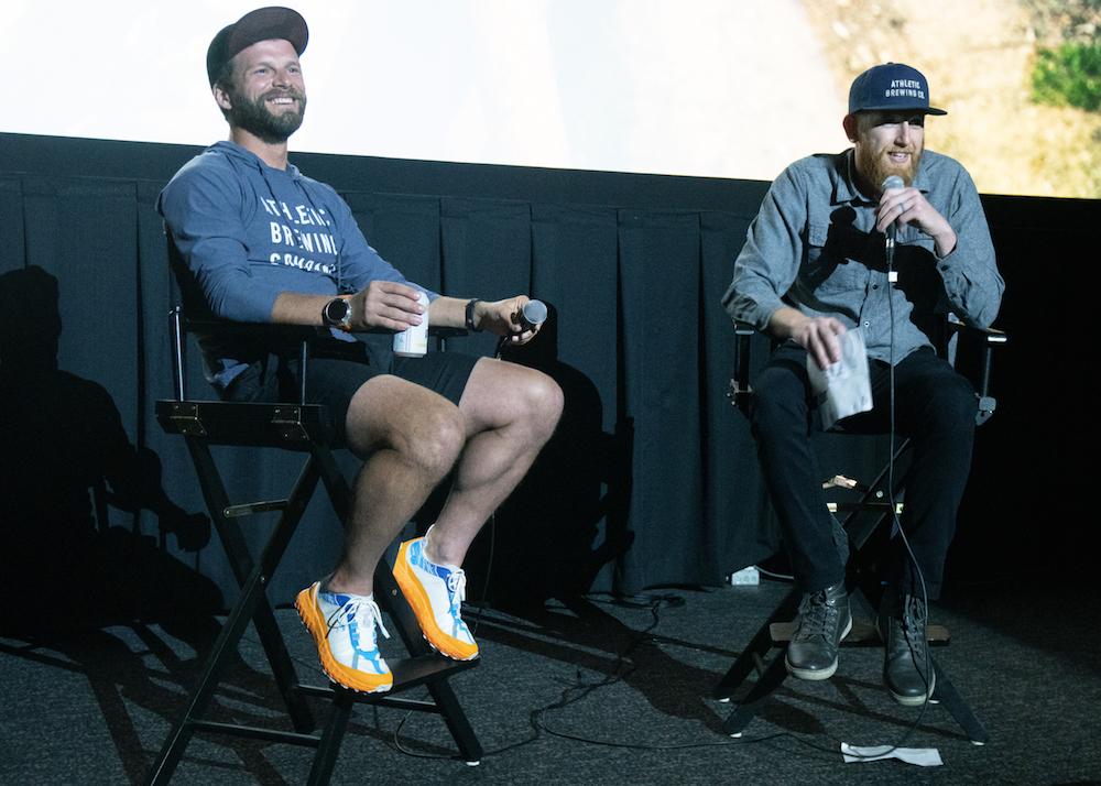 Mountaineer Jason Hardrath (R) and Mason Gravely, a marketing executive at Athletic Brewing, during a Q&A with the audience at the premiere of "Journey to 100" in Brooklyn, N.Y., on April 9, 2022. (Dave Paone/The Epoch Times)