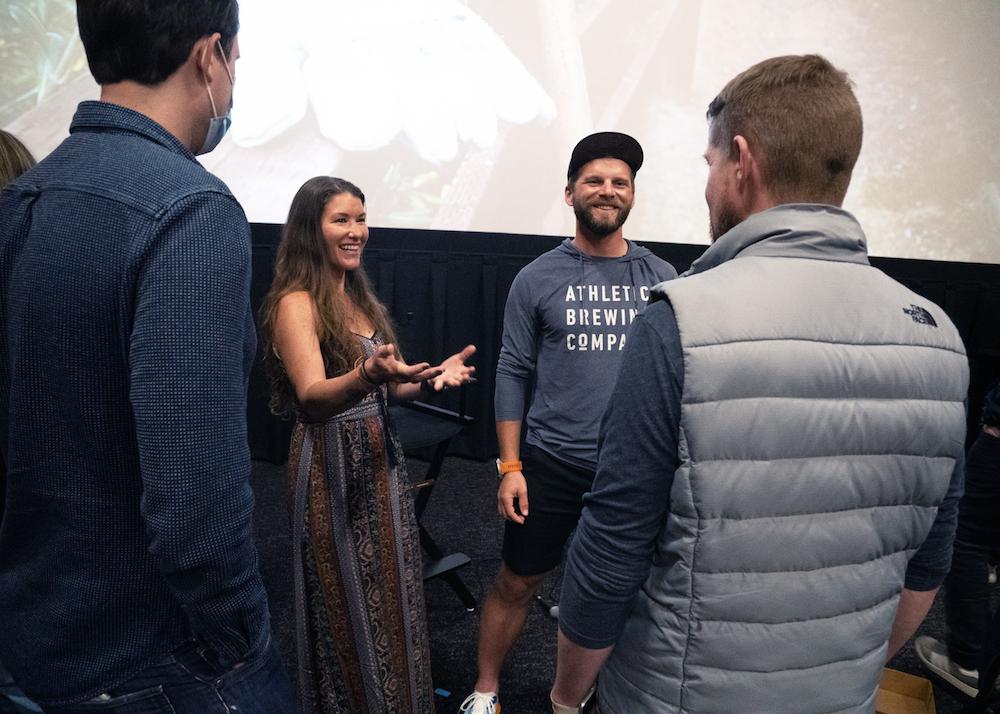 Mountaineer Jason Hardrath and his partner, Ashly Winchester, have a meet-and-greet with audience members at the premiere of "Journey to 100" in Brooklyn, N.Y., on April 9, 2022. (Dave Paone/The Epoch Times)