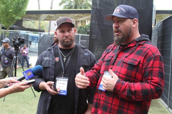 Mike Landis (L) and Brian Brase, truckers and organizers of The People’s Convoy, speak at the “Defeat the Mandates” rally in Los Angeles on April 10, 2022. (Brad Jones/The Epoch Times)