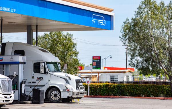 A semi-truck fills up with diesel fuel outside of Bakersfield, Calif., on April 18, 2022. (John Fredricks/The Epoch Times)