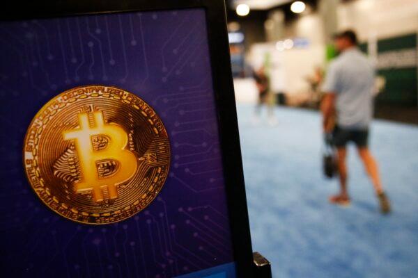 A bitcoin logo is seen during the Bitcoin 2022 Conference at Miami Beach Convention Center, in Miami, Florida, on April 8, 2022. (Marco Bello/Getty Images)
