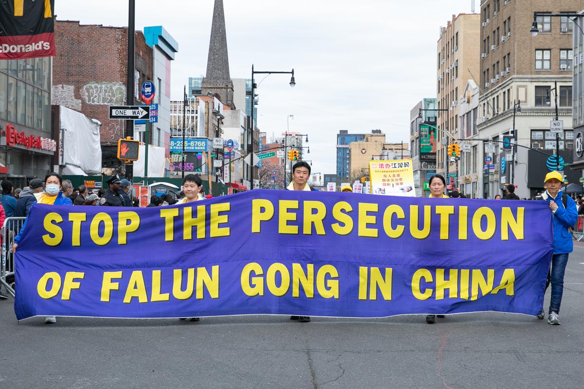 Falun Gong practitioners participate in a parade to commemorate the 23rd anniversary of the April 25th peaceful appeal in Beijing, in Flushing, N.Y., on April 23, 2022. (Chung I Ho/The Epoch Times)