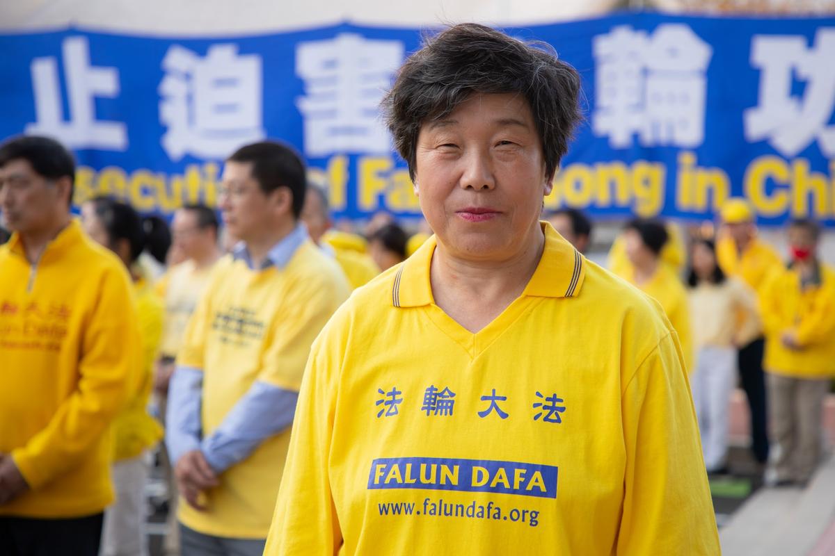 Falun Gong practitioner Fan Minghua participate in an event to commemorate the 23rd anniversary of the April 25th peaceful appeal in Beijing, in Washington, on April 23, 2022. (Lynn Lin/The Epoch Times)