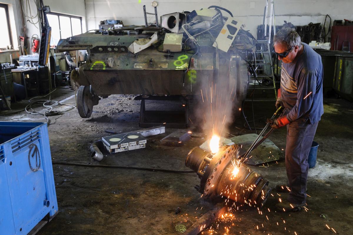 A technician uses a welder's torch to cut parts off a Gepard antiaircraft cannon tank that once belonged to the Bundeswehr at the Battle Tank Dismantling GmbH Koch in Edeleben, Germany, on April 23, 2014. Since the early 1990s, the company has dismantled over 15,000 tanks and other armored vehicles, from German, Austrian, French, and other European arsenals, as many nations reduce their military forces in accordance with the Conventional Armed Forces in Europe Treaty. (Jens Schlueter/Getty Images)