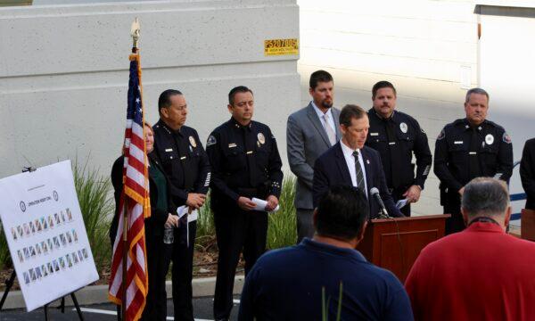 Federal and local authorities gather at a press conference to discuss federal indictments charging 31 members and associates of the Mexican Mafia in Orange, Calif., on April 27, 2022. (Brandon Drey/The Epoch Times)