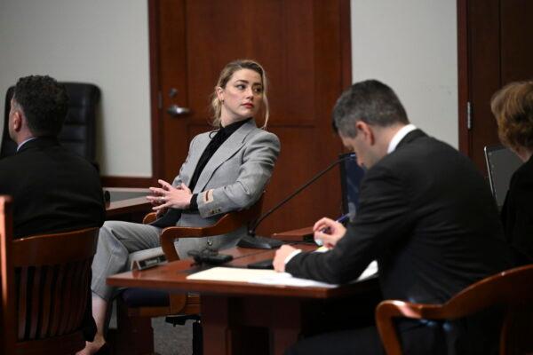 Actress Amber Heard looks on inside the courtroom at the Fairfax County Circuit Court in Fairfax, Va., on April 12, 2022. (Brendan Smialowski, Pool via AP)