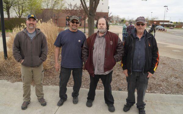 Union workers Jason Mueller (L), Anthony Stella (2L), Phillip Sinta (2R), and Gary Vallance (R) attend the premiere of "2000 Mules" in Michigan on May 2, 2022. (Steven Kovac/The Epoch Times)