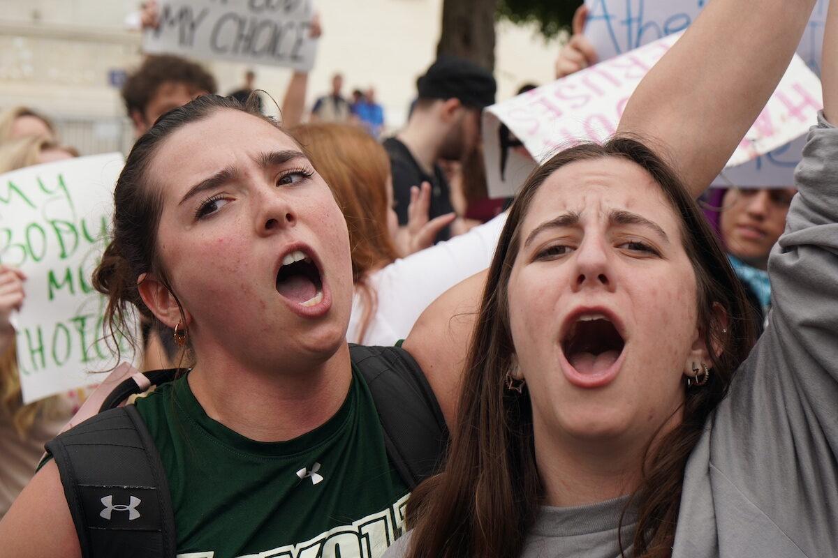 Pro-abortion protestors shout before the U.S. Supreme Court in Washington on May 4, 2022. (Jackson Elliott/The Epoch Times)