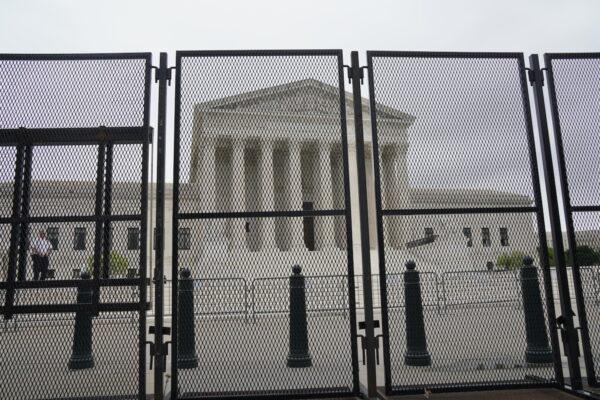 Tall, heavy barricades surround the U.S. Supreme Court in Washington on May 5, 2022. (Jackson Elliot/The Epoch Times)