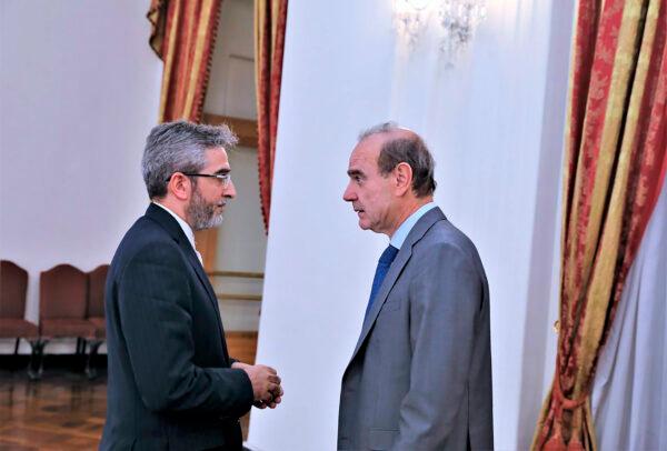 Enrique Mora, a leading European Union diplomat (R), speaks with Iran's top nuclear negotiator Ali Bagheri Kani (L), in Tehran, Iran, on May 11, 2022. (Iranian Foreign Ministry via AP)