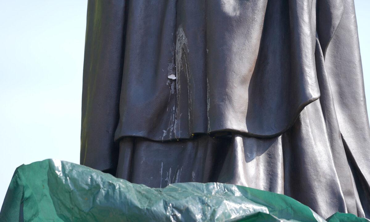 The contents of a thrown egg drip down the newly installed statue of Baroness Margaret Thatcher in her hometown of Grantham, Lincolnshire, England, on May 15, 2022. (Joe Giddens/PA Media)