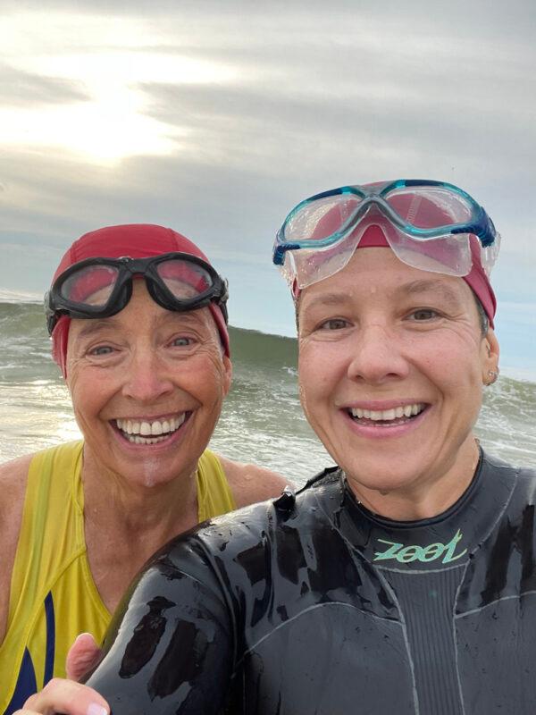 Jeanne Mitchell (left) swims with Jess Wargo (right) in the Atlantic Ocean to prepare for a race. (Jeanne Mitchell)