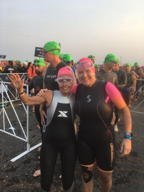 Mitchell (left), with friend Jess Wargo (right), ready to swim in a race. (Jeanne Mitchell)