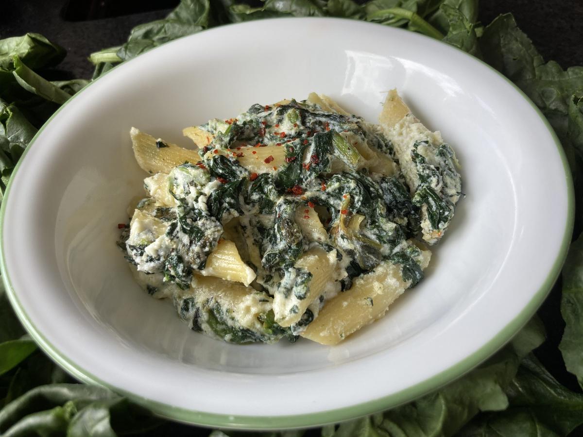 Dense, earthy spinach adds pockets of green to these bright and creamy lemon-ricotta noodles. (Ari LeVaux)