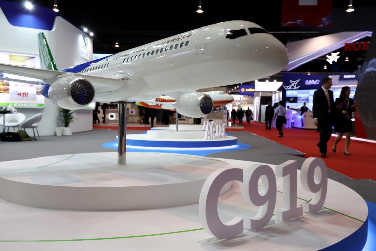 A model of the Commercial Aircraft Corp. of China Ltd. (Comac) C919 aircraft sits on display at the Singapore Airshow held at the Changi Exhibition Center in Singapore on Feb. 6, 2018. The state-owned Chinese company seeks to chase markets in Asia and Africa. (Seong Joon Cho/Bloomberg via Getty Images)