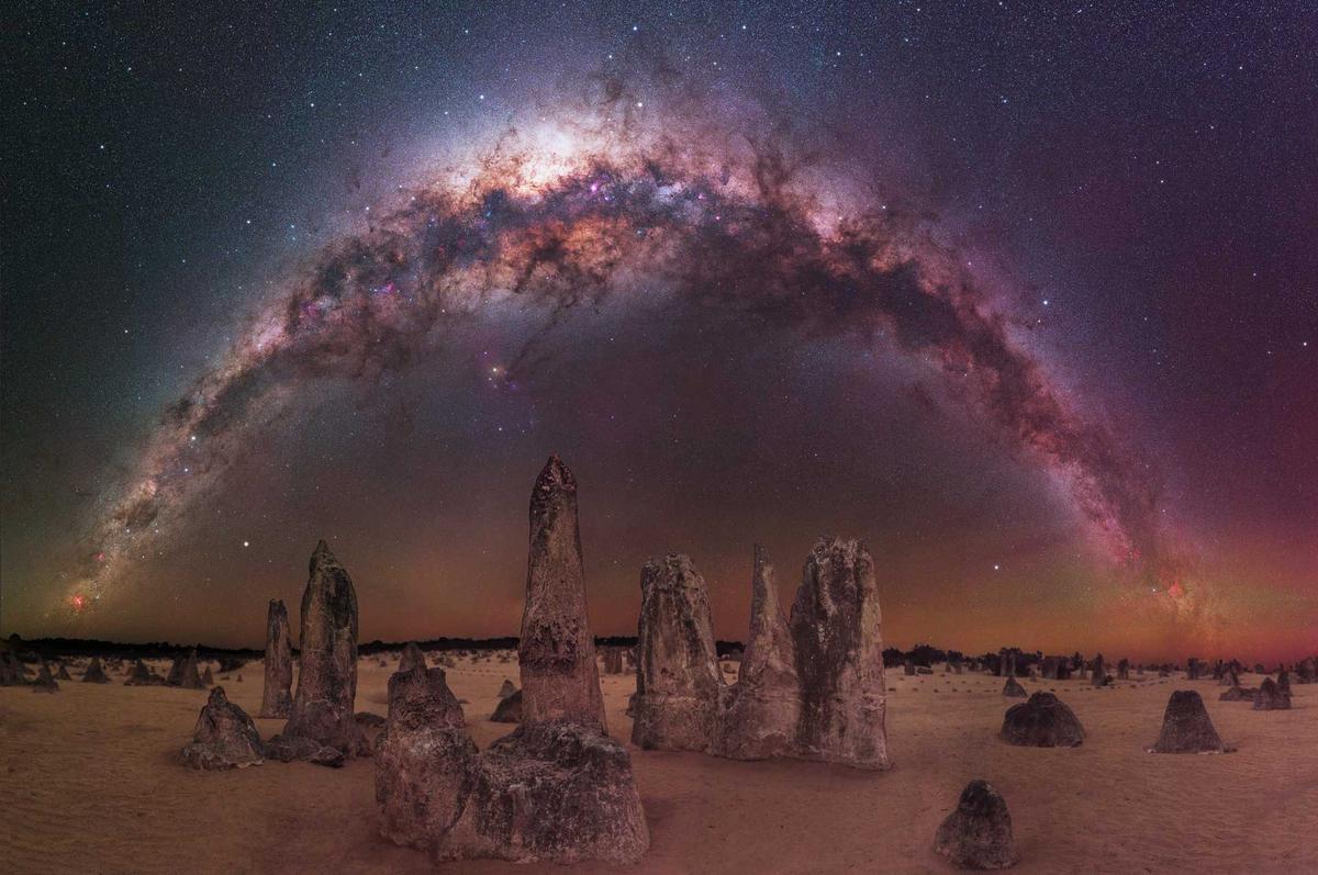 “The Milky Way arching over The Pinnacles Desert” – Trevor Dobson. (Courtesy of Trevor Dobson via Capture the Atlas)