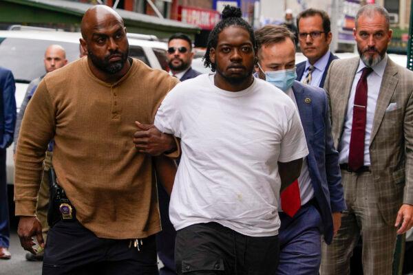 Andrew Abdullah is escorted into the Fifth precinct in New York on May 24, 2022. (Mary Altaffer/AP Photo)
