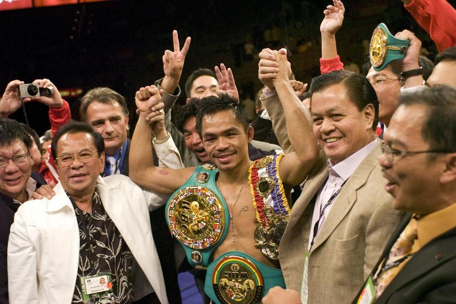 Manny Pacquiao (center) winning a belt in "Manny." (Gravitas Ventures/Universal Pictures)