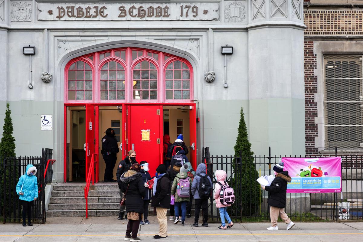 Children line up as they enter a public school in New York City on Dec. 7, 2020. (Michael M. Santiago/Getty Images)