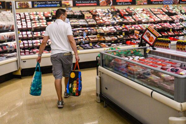 A person shops in a supermarket in Washington, D.C., on May 26, 2022, as Americans brace for summer sticker shock as inflation continues to grow. (NICHOLAS KAMM/AFP via Getty Images)