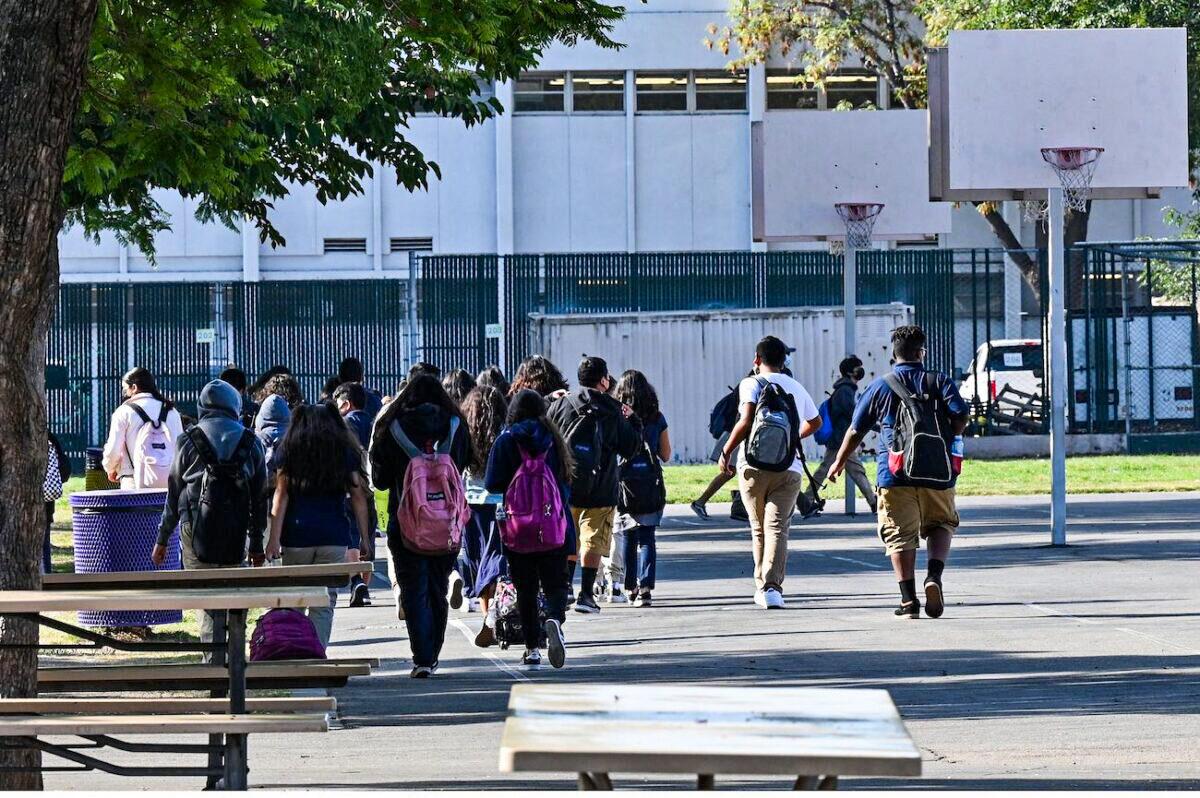 Students walk to their classrooms at a public middle school in Los Angeles, Calif., on Sept. 10, 2021. (Robyn Beck/AFP via Getty Images)